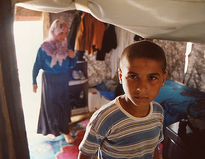 Yoka, 13, inside tent home